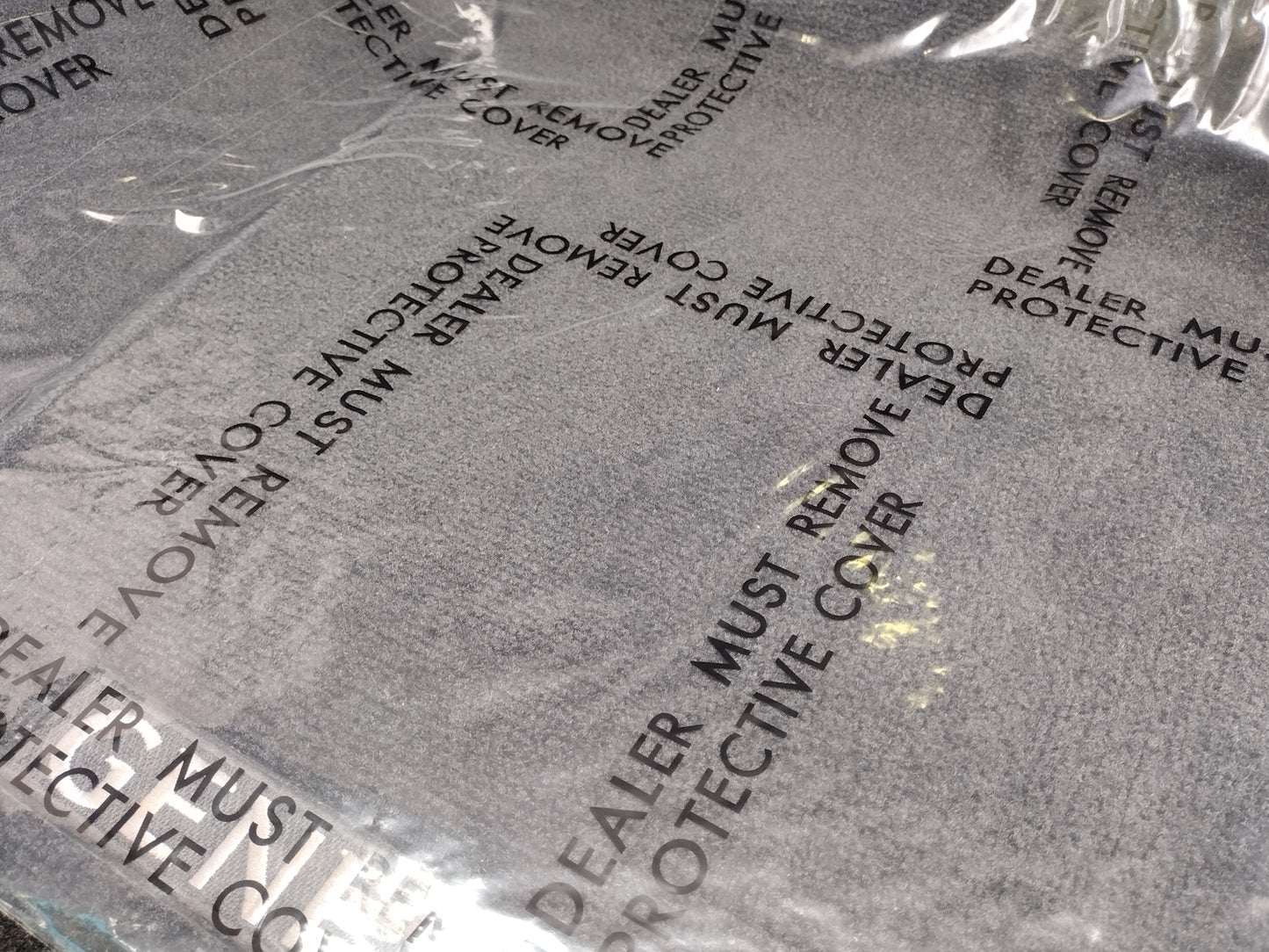 Adhesive Plastic "Dealer Must Remove" Car Floor Mats